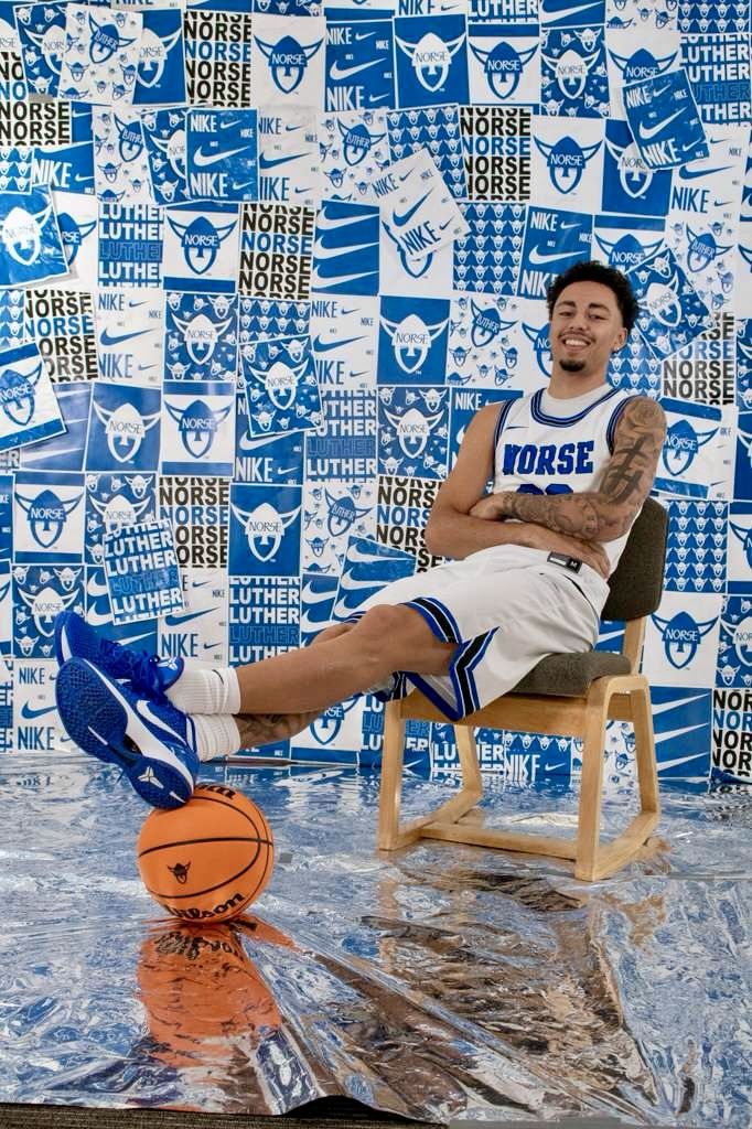 Kyanu leaning back on a chair, feet on a ball